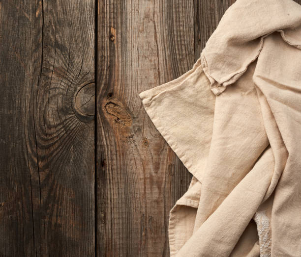 istock gray kitchen textile towel folded on a gray wooden table from old boards, top view 1215718818