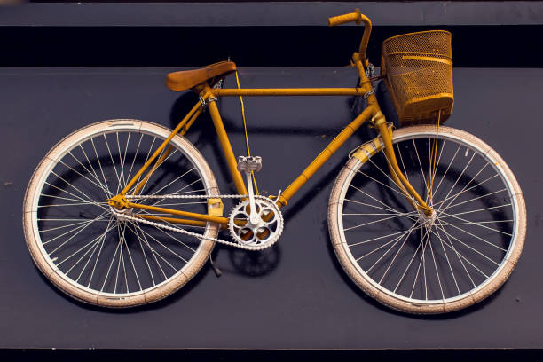 istock Vintage bicycle hanging on the wall as an element of design 1215719496