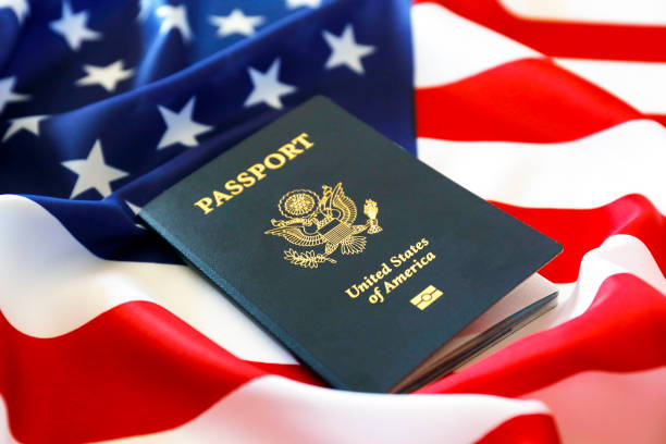 istock Passport of the US citizen. Identification document over bright background. 1215720533