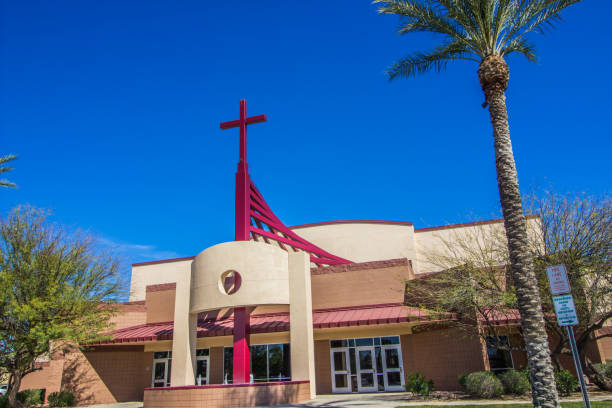 istock Modern Church With Cross And Palm Tree 1215720960