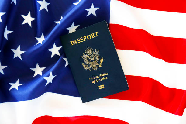 istock Passport of the US citizen. Identification document over bright background. 1215720980