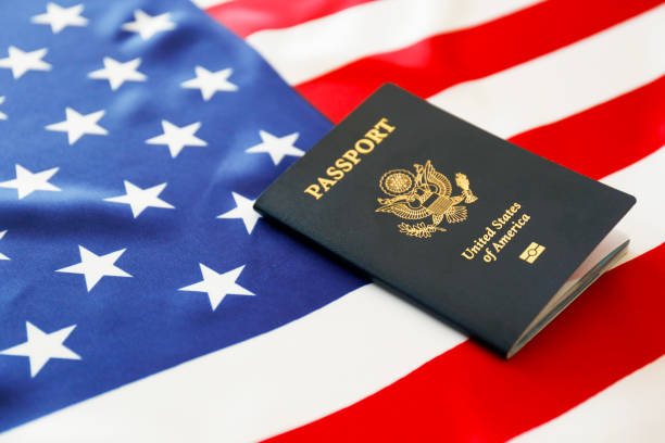 istock Passport of the US citizen. Identification document over bright background. 1215721270