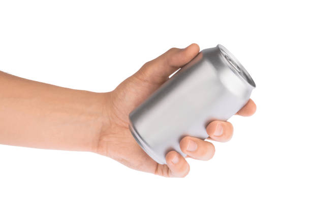istock Hand holds metal beverage drink can isolated on white clipping path 1215721307