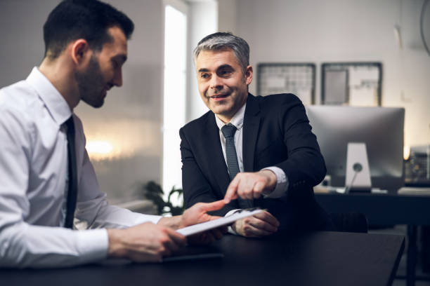 istock Male happy colleagues are discussing their plans 1215723493