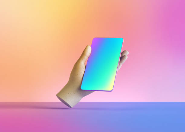 istock 3d render mannequin hand holding smart phone gadget, electronic device isolated on colorful pastel background, minimal concept, simple clean design. Remote control. Limb prosthesis 1215724853