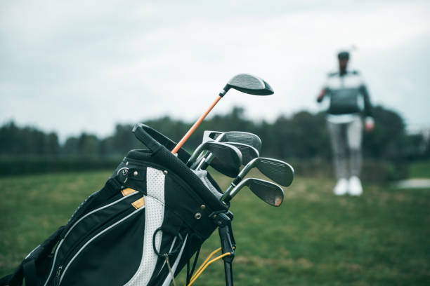 istock Close-up shot of a golf bag in a golf course 1215724876