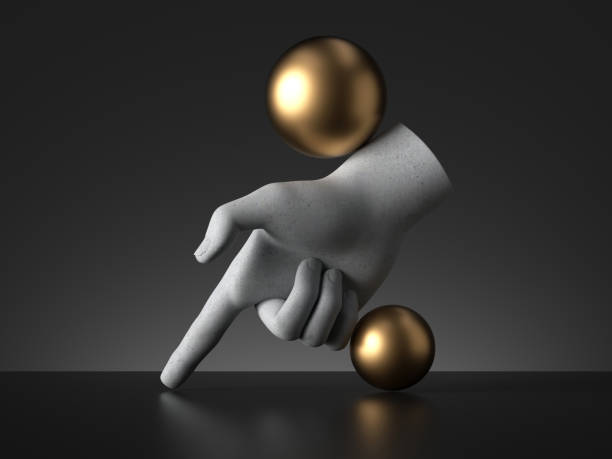 istock 3d render, mannequin hand and golden balls, finger pointing down isolated on black background. Direction gesture, magical trick, minimal fashion concept, simple clean design. Human limb prosthesis 1215725097