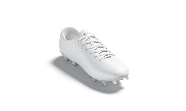 istock Blank white soccer boot with rubber cleats mockup, isolated 1215726095