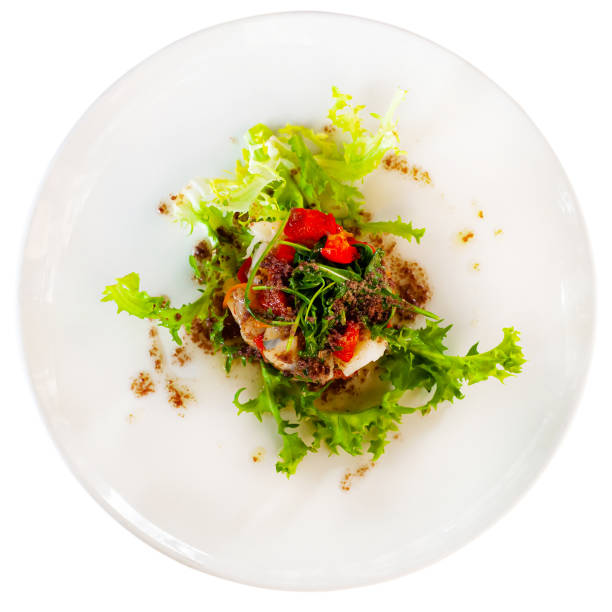 istock Cod timbale with baked red pepper, rocket and olive tapenade 1215726271