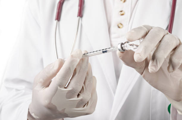 istock Injecting vaccination medicine on man doctor 1215726550