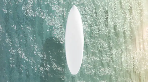 Blank white surfboard on water surface mockup, top view, 3d rendering. Empty training deck on blue ocean or sea deep mock up. Clear wakeboarding watersports plank mokcup template.