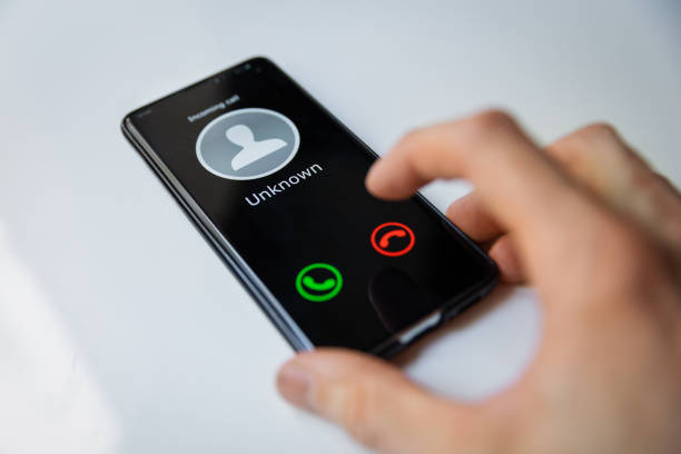 istock smartphone with incoming call from unknown person 1215726906