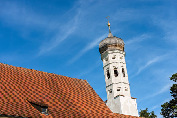 Colomanskirche or Saint Coloman Church, in Baroque style. Close-up of the bell tower and the roof. Schwangau, Allgau, Bavaria, Germany