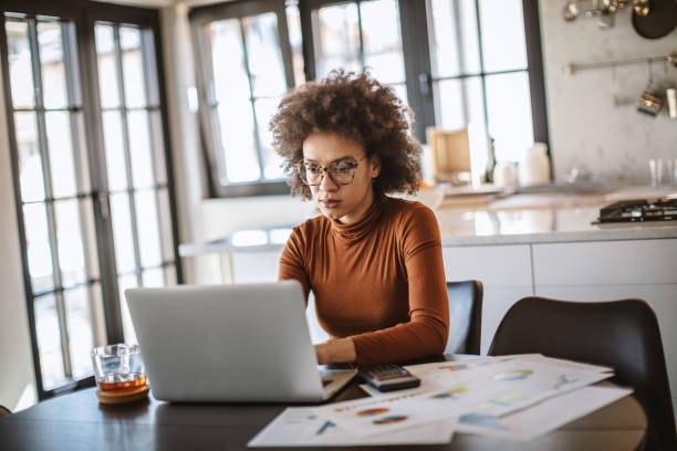 istock Beautiful young woman working from home 1215727538