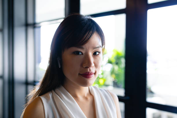 istock Asian woman wearing wireless headphone 1215727628