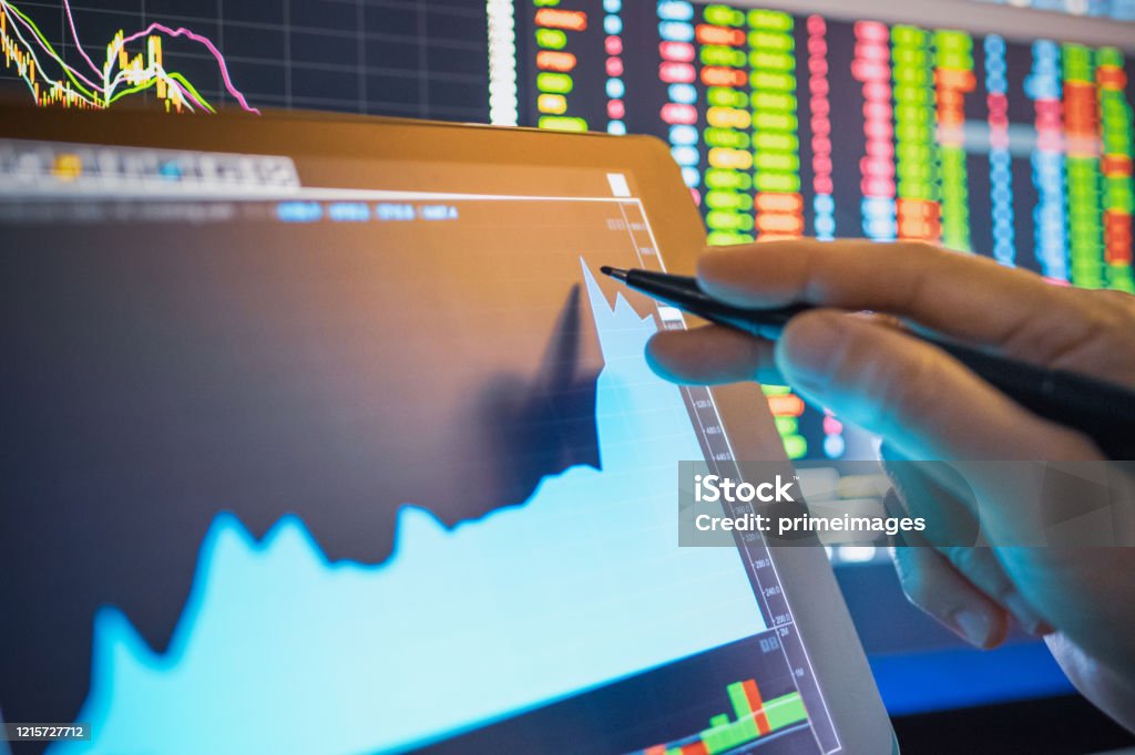 Businessman analysis stock chart in crisis covid-19 for investment in stockmarket and finance business planning selective stock for Stockmarket crash and Financial crisis Stock Market and Exchange Stock Photo