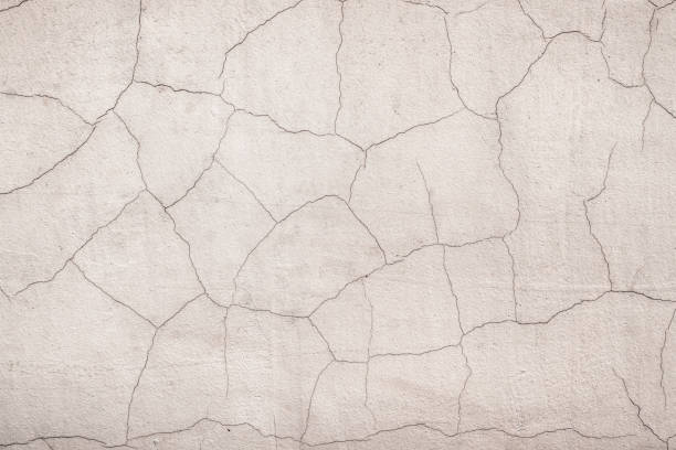 istock Old cracked wall with peeling stucco 1215732315