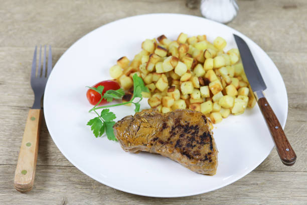 istock grilled beef fillet and browned potatoes 1215732510