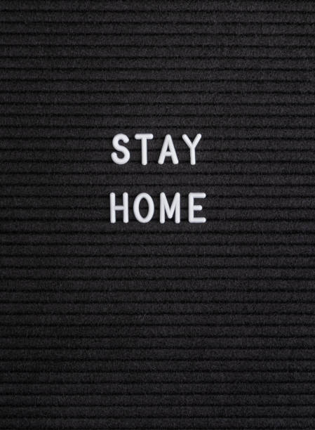 istock The words Stay Home on black felt letter board 1215733489