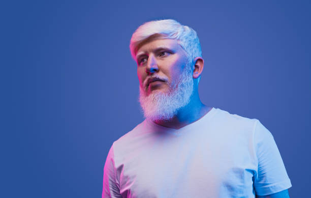 istock Confident adult man with albinism looking away 1215733643
