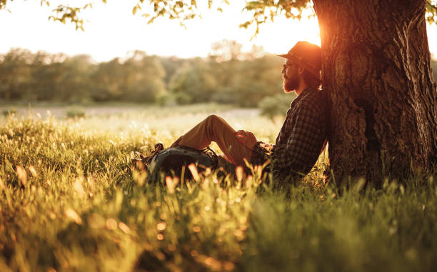istock Bearded traveler resting near tree 1215733655