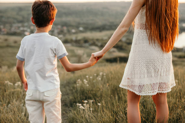 istock Anonymous siblings admiring nature together 1215733757