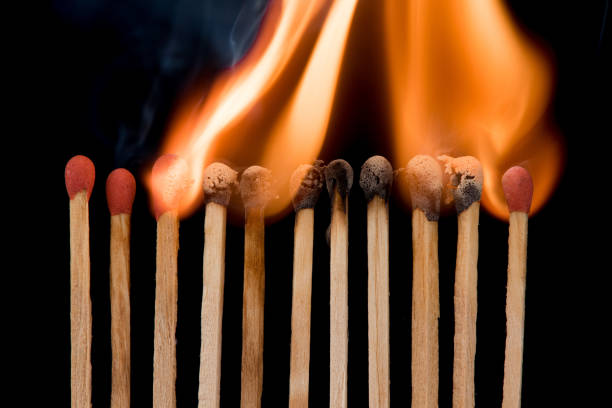 istock Group of match burn spread fire on black background disease coronavirus covid-19 quarantine social distancing concept 1215733840
