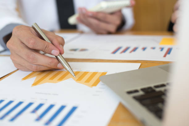 istock Financial and investment planning, Head of Marketing is analyzing data from the summary graph statistics for executives, business meetings. 1215734136