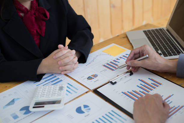 istock Financial and investment planning, Head of Marketing is analyzing data from the summary graph statistics for executives, business meetings. 1215734139