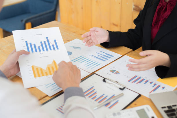 istock Financial and investment planning, Head of Marketing is analyzing data from the summary graph statistics for executives, business meetings. 1215734160