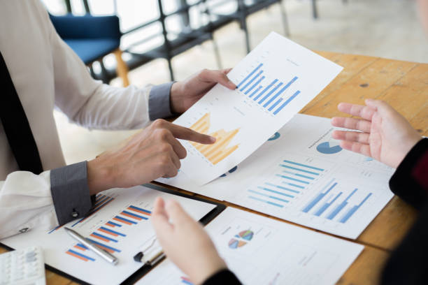 istock Financial and investment planning, Head of Marketing is analyzing data from the summary graph statistics for executives, business meetings. 1215734169