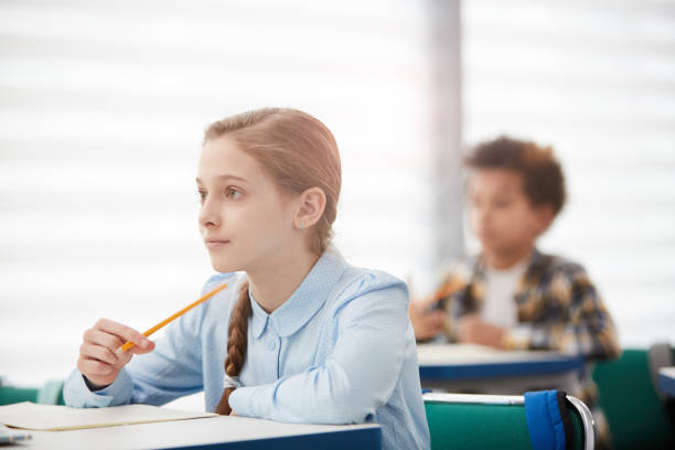 istock Children Listening in Class 1215734407