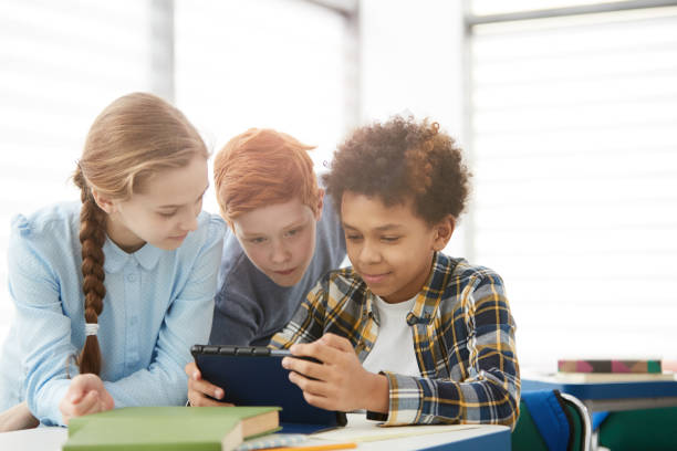 istock Group of Kids Using Tablet in School 1215734425