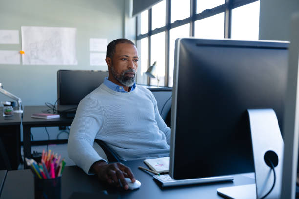 istock African American man working in office 1215734593