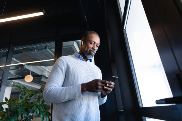 istock African American man using his phone 1215734775