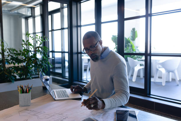istock African American man working in modern office 1215734782