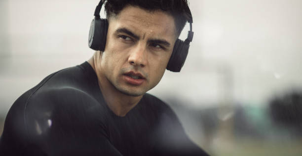 istock Athlete listening music during workout break 1215735714