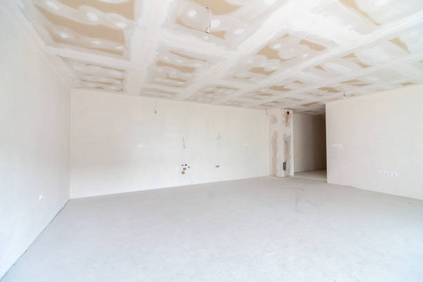 istock New empty room under construction. Plaster walls. New home. Concrete walls. Interior renovation. 1215735842