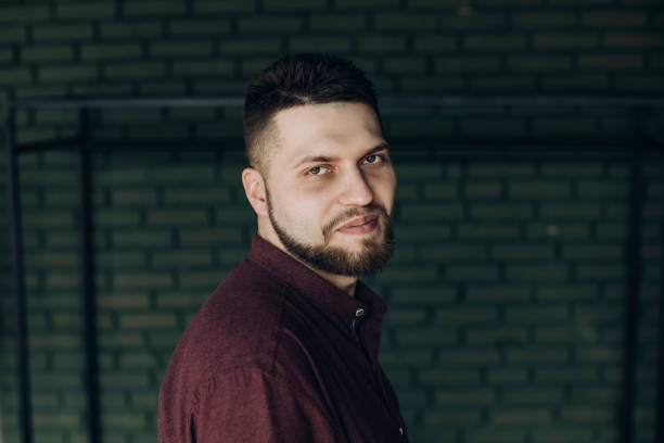 istock Portrait Of bearded Young Man on darck background 1215736541