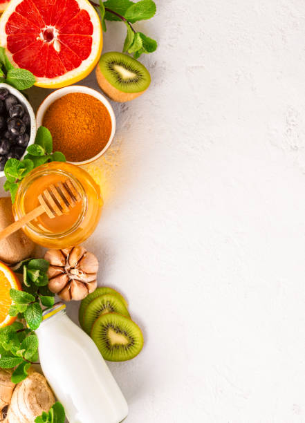 istock Healthy products for Immunity boosting on white background with copy space top view. Vegetables and fruits to boost immune system 1215736720