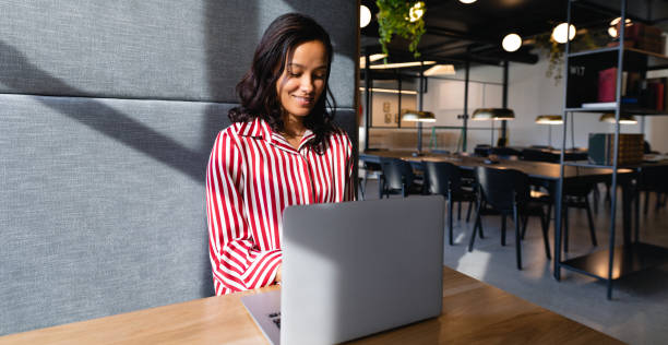 istock African American woman using her laptop 1215738233