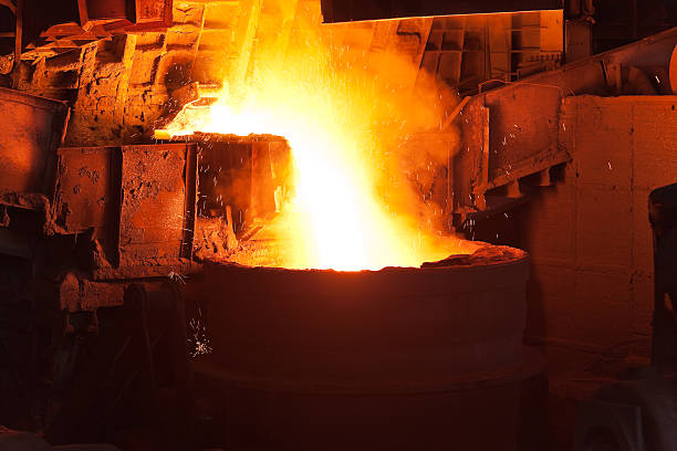 istock Pouring of liquid metal in open hearth workshop 121573943