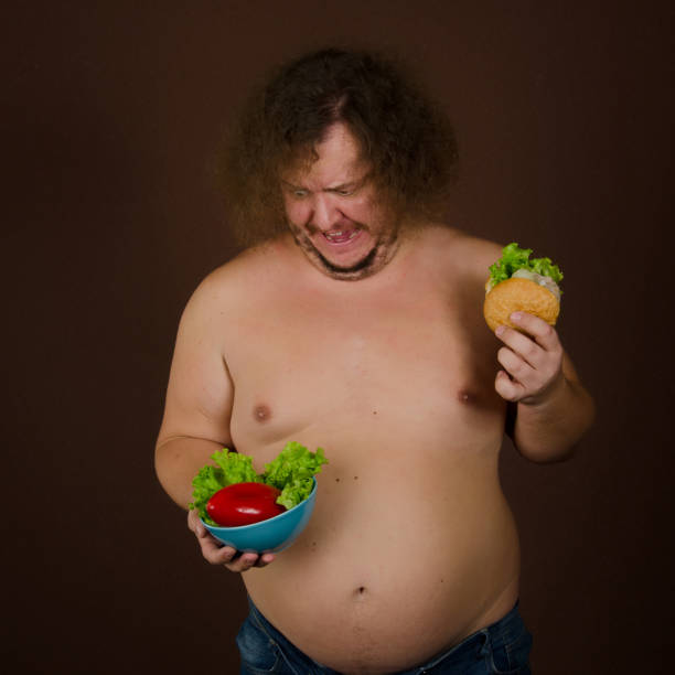 istock Funny fat man on a diet. 1215741246