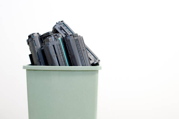 istock Spent cartridges close-up stacked in a container on a white background. 1215741522