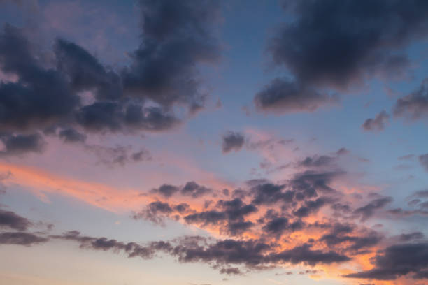 istock Pink clouds and blue skies background 1215741583
