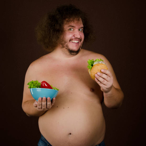 istock Funny fat man on a diet. 1215741607