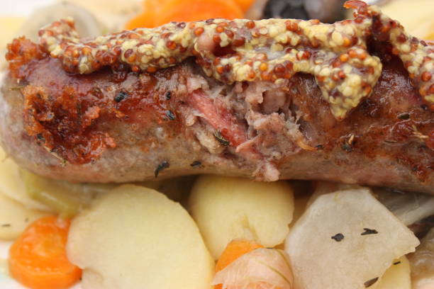 istock Andouillette served with various vegetables   Old mustard seasoning 1215741802