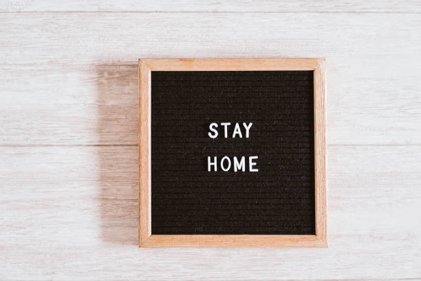 istock letter board with STAY HOME message. coronavirus convid 2019 concept 1215742912
