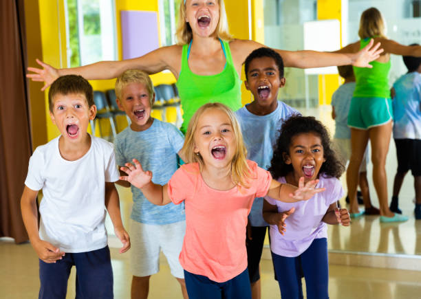 istock Positive children in dance studio smiling and having fun 1215743106