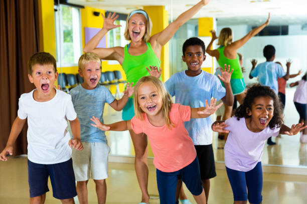 istock Positive children in dance studio smiling and having fun 1215743116